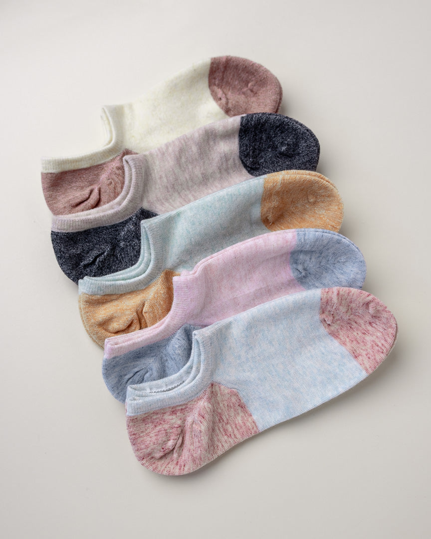 Set of colorful ankle socks on a light background