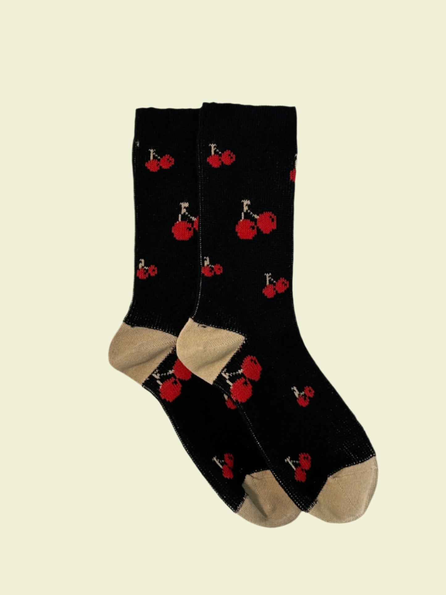 Black socks with red and white designs on a light gray background