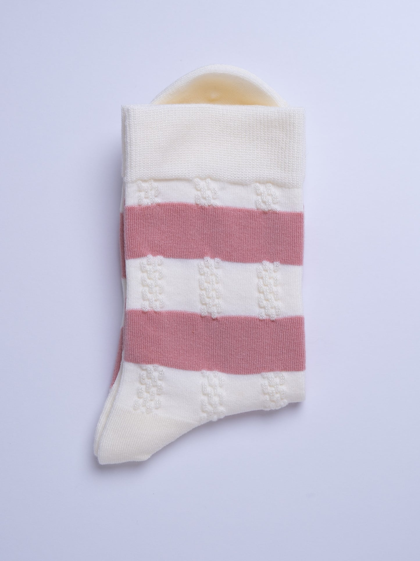 Striped sock with pink and white pattern on a light gray background