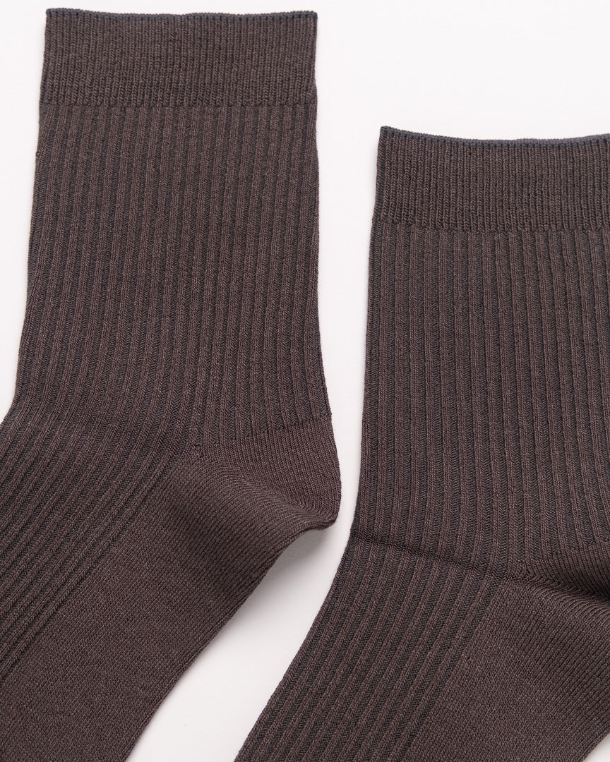 Pair of brown socks on a white background