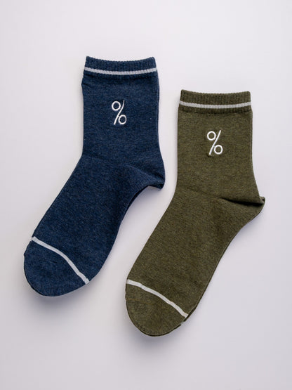 Two socks, one blue and one green, with a percentage symbol on a light gray background.