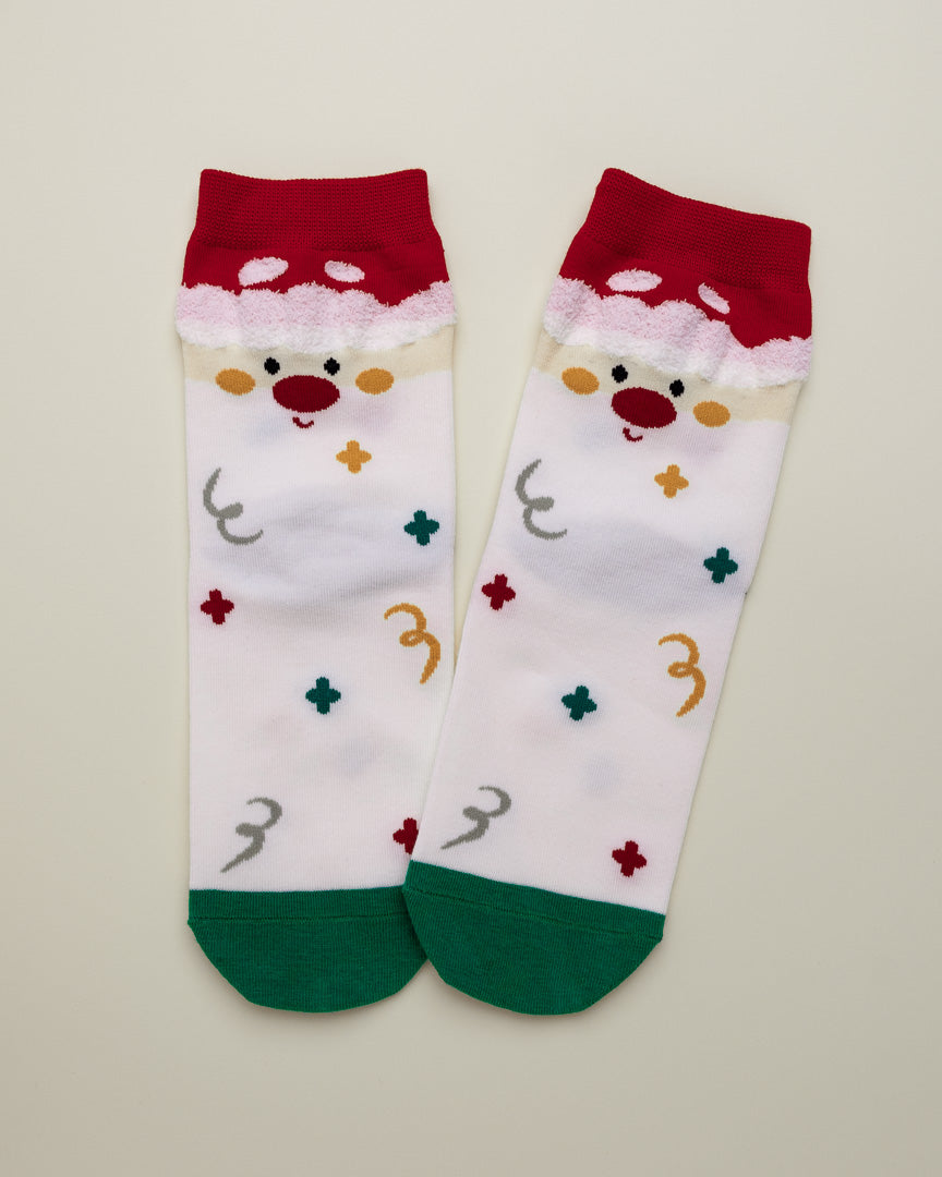 Pair of socks with a reindeer design on a beige background