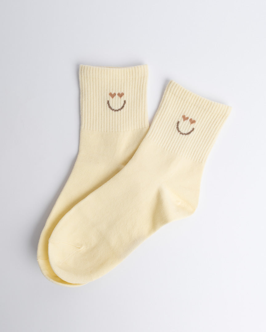 Butter yellow women’s cotton quarter socks with subtle smiley detail