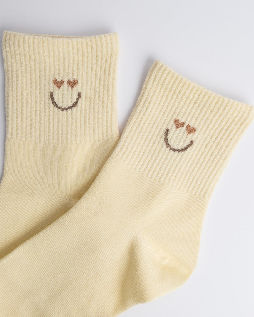 Close-up of women’s cotton quarter socks showing soft knit and smiley design