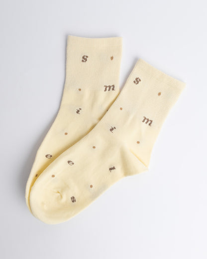 Butter yellow women’s cotton quarter socks with alphabet pattern