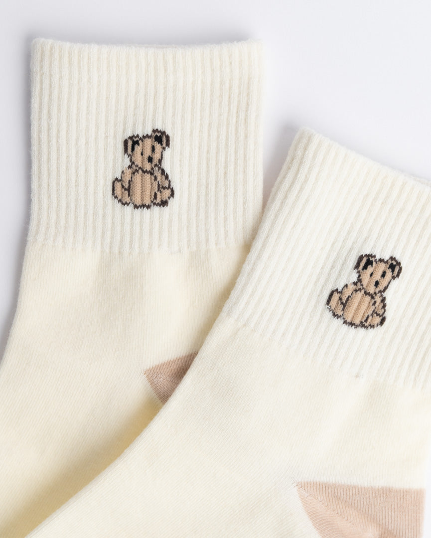 Close-up of teddy bear embroidery on women’s cotton quarter socks