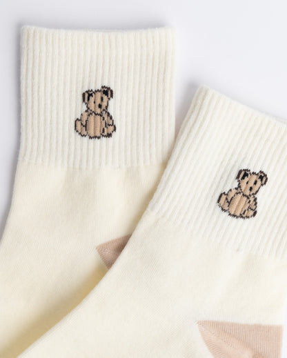 Close-up of teddy bear embroidery on women’s cotton quarter socks