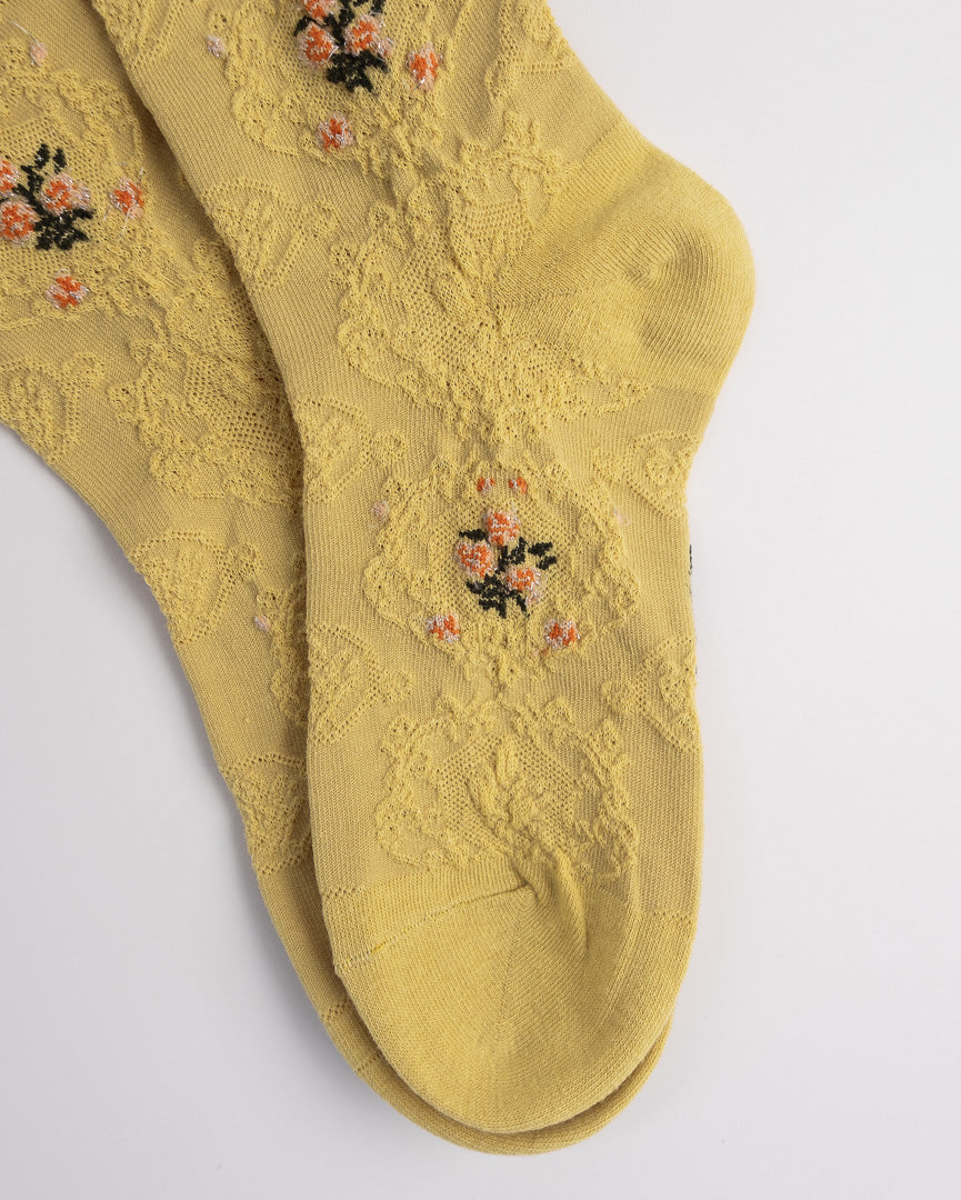 Close-up of textured floral knit women’s cotton socks breathable soft fabric