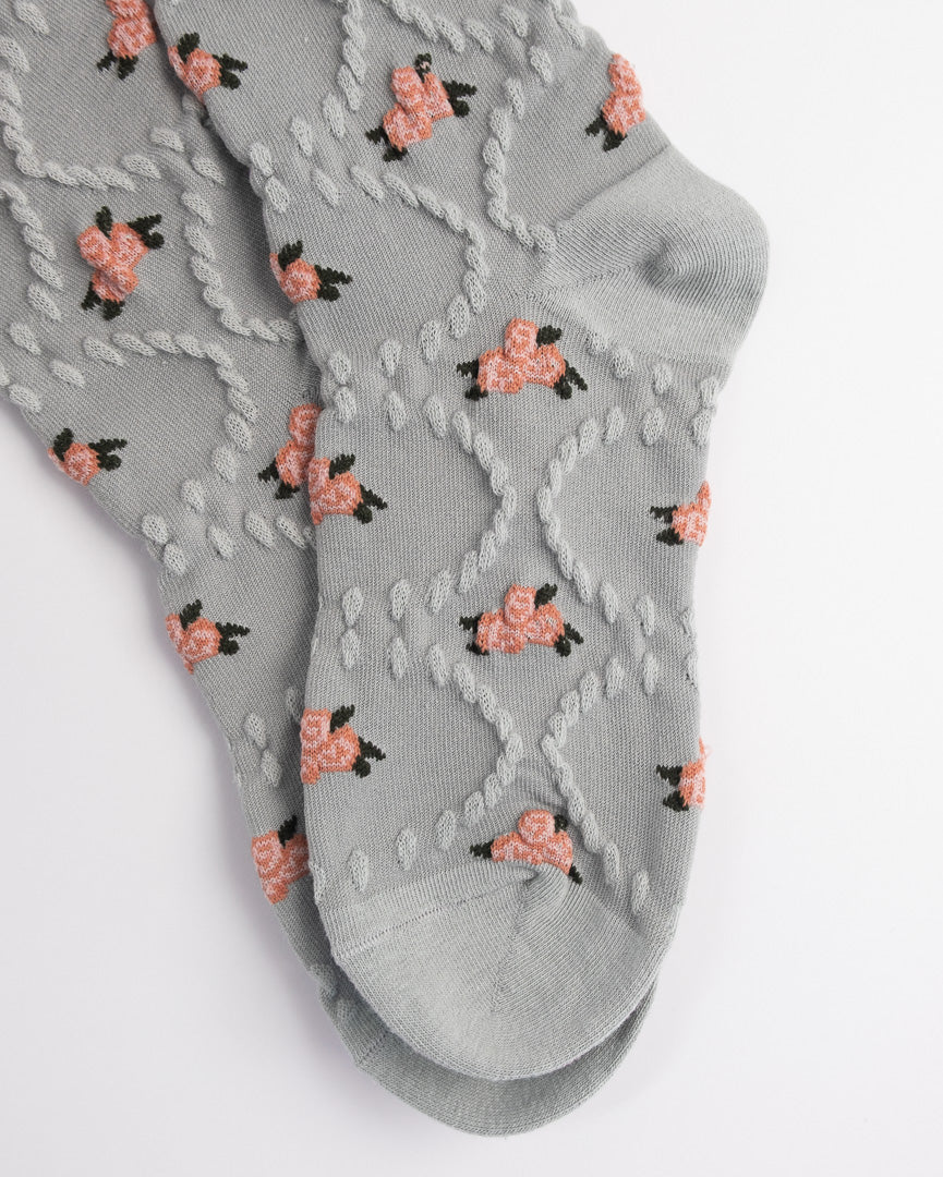 Gray ankle socks with floral pattern on a white background