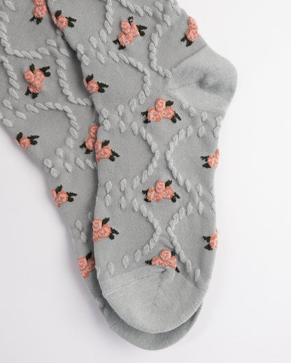 Gray ankle socks with floral pattern on a white background