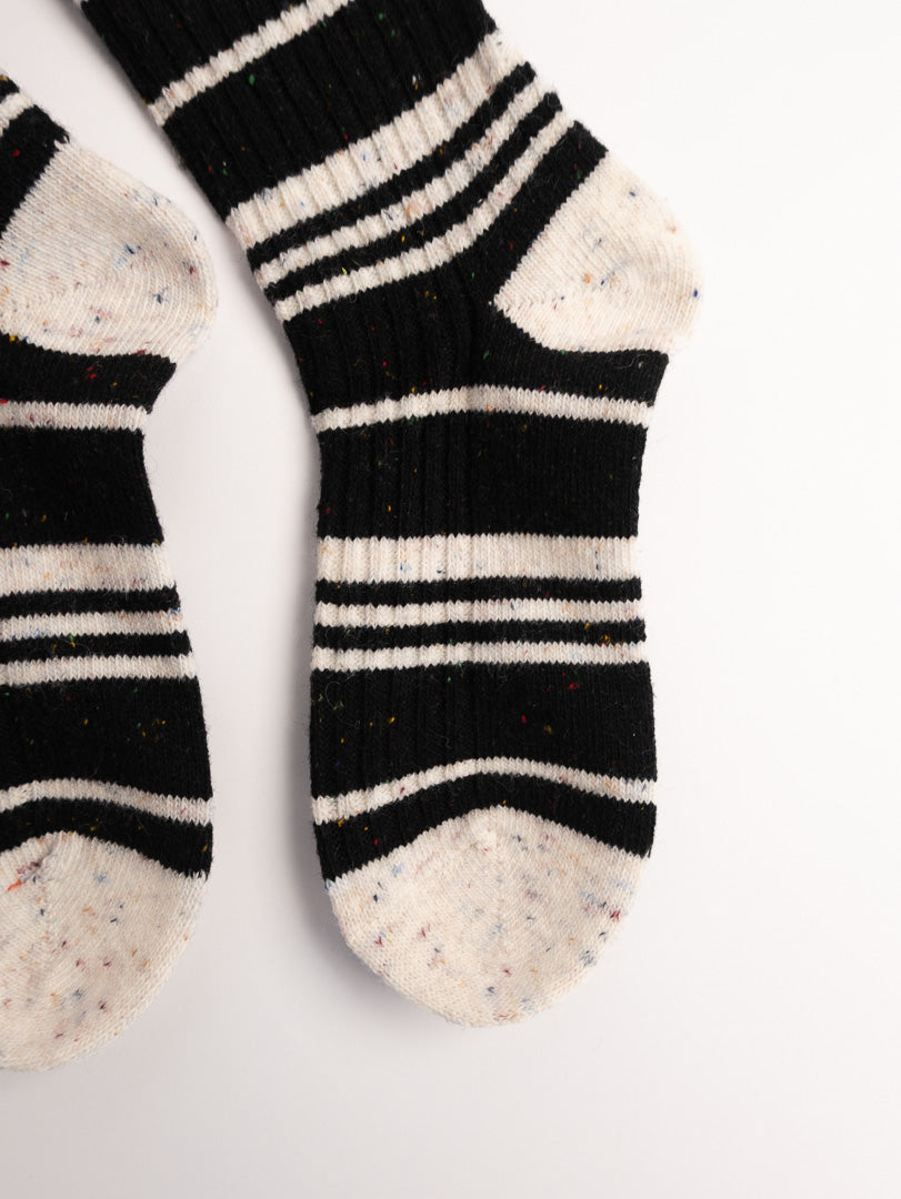 women black white striped fuzzy socks close up soft cozy texture winter socks