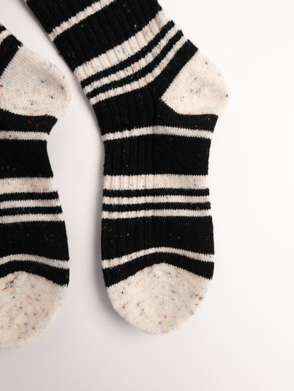 women black white striped fuzzy socks close up soft cozy texture winter socks