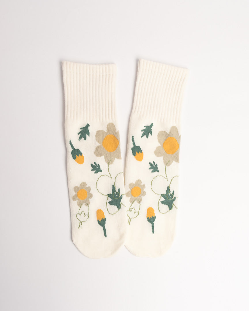 Pair of socks with floral design on a light gray background
