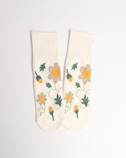 Pair of socks with floral design on a light gray background
