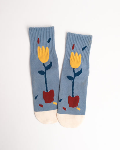 Pair of socks with floral design on a light gray background