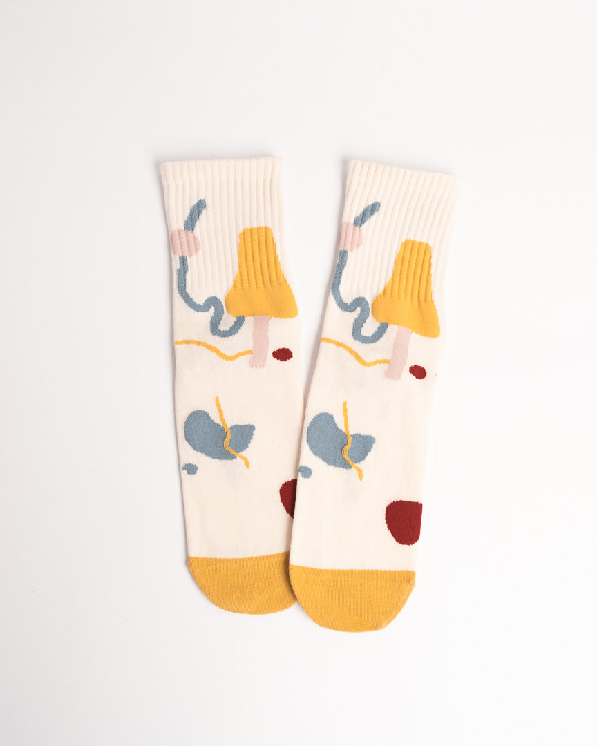 Pair of socks with colorful elephant design on a white background