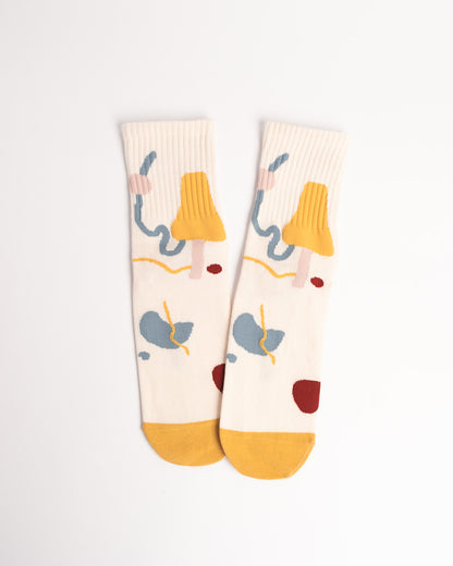 Pair of socks with colorful elephant design on a white background