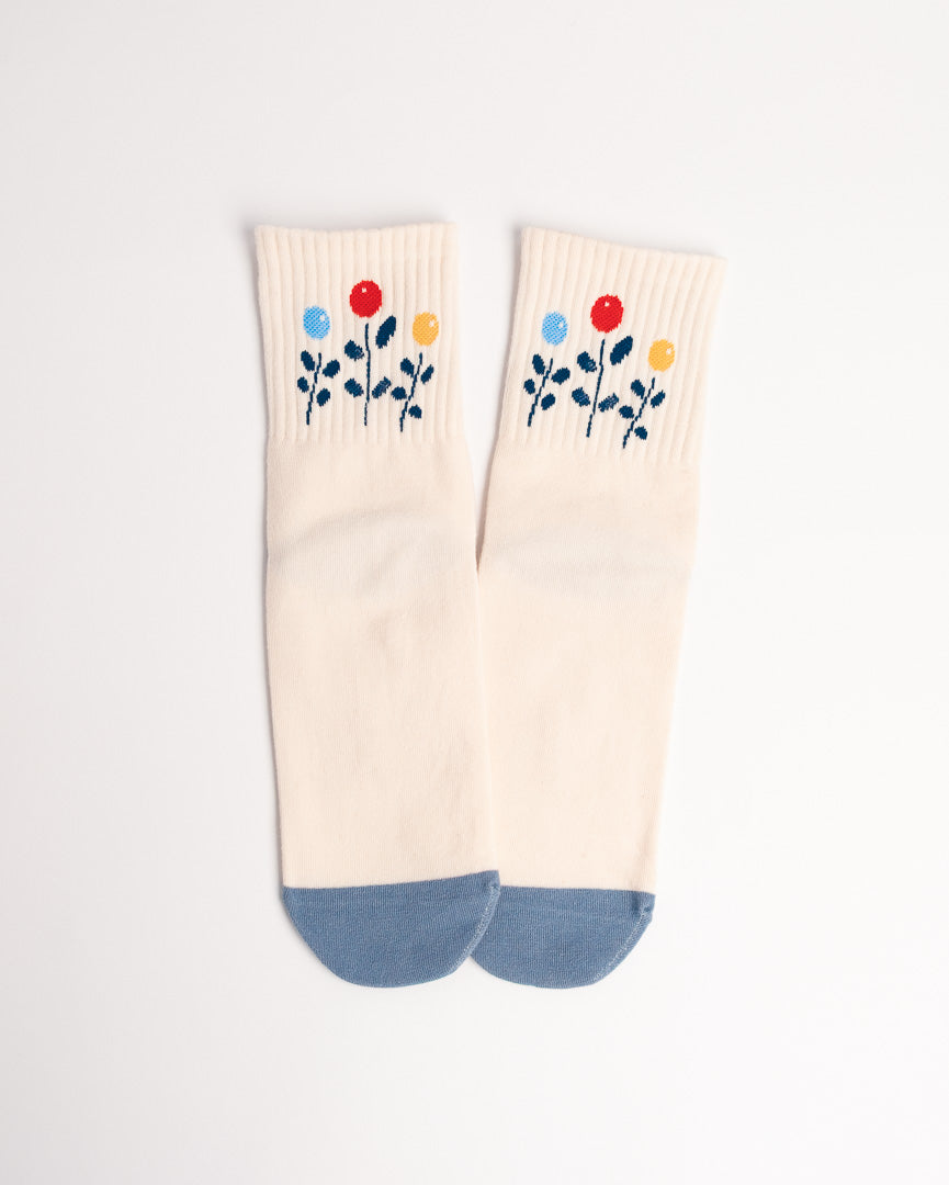 Pair of socks with floral design on a white background