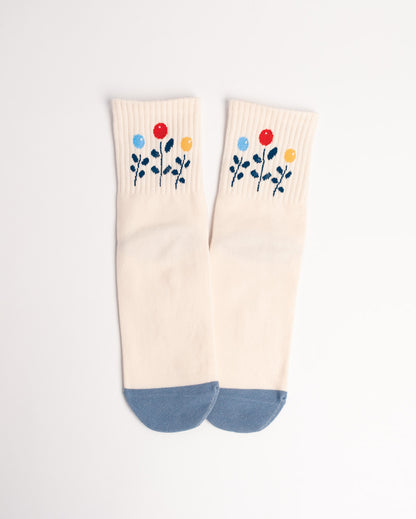 Pair of socks with floral design on a white background