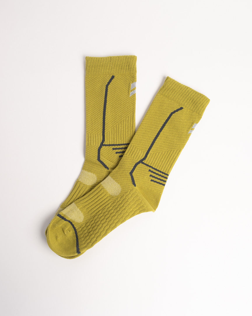Men's yellow performance crew socks with breathable athletic design and arch support