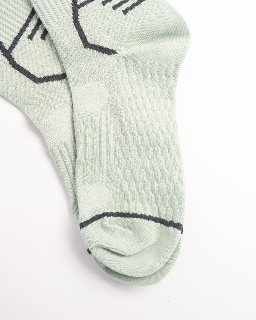 Men's sage green performance crew socks with breathable sports design and everyday comfort