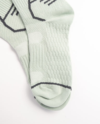 Men's sage green performance crew socks with breathable sports design and everyday comfort