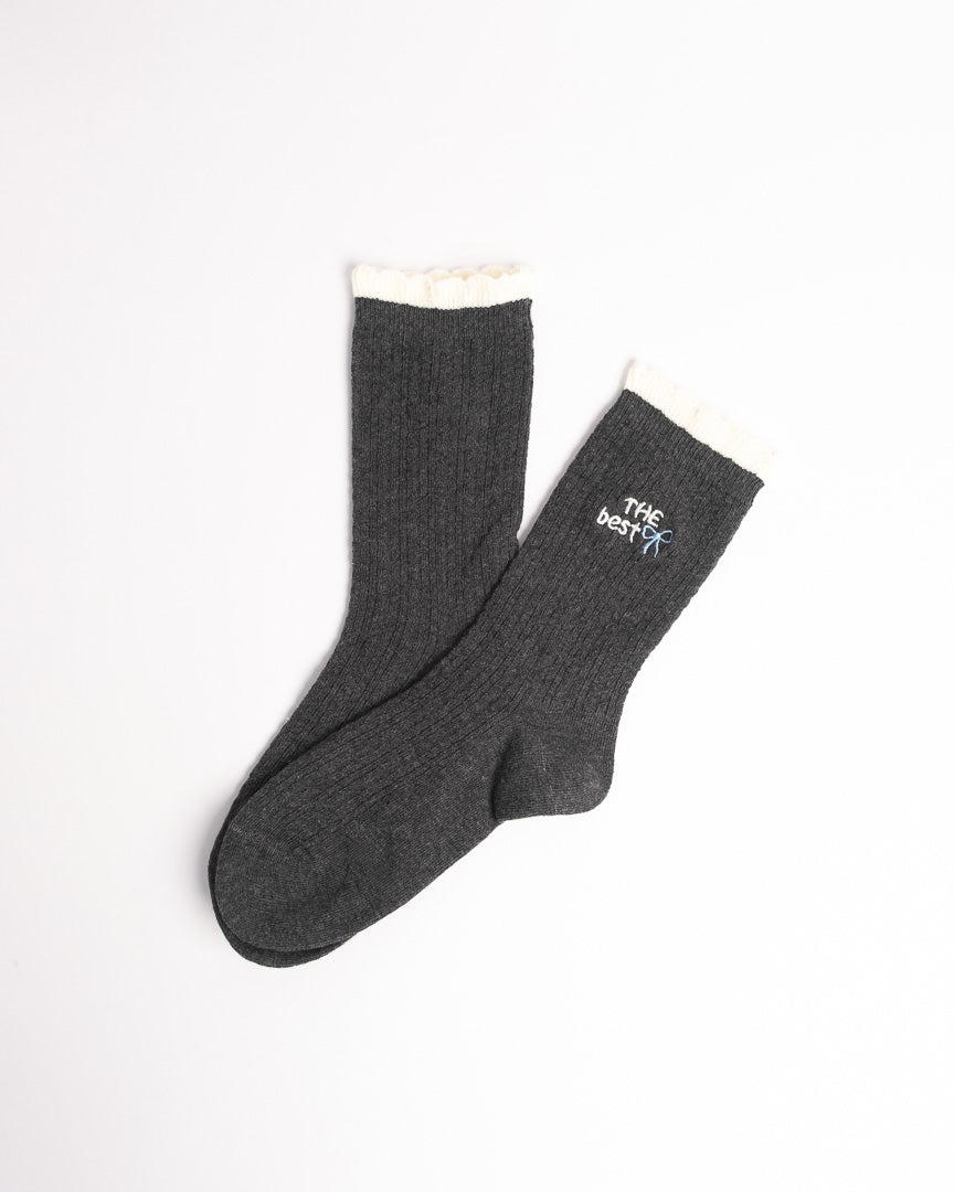 Women's ribbed cotton crew socks with contrast ruffle cuff and bow embroidery in black, cream and grey