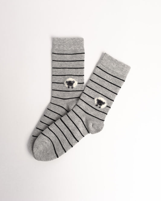 A pair of gray crew socks with thin black horizontal stripes and a small white-and-black sheep motif near the cuff, displayed on a clean white background.