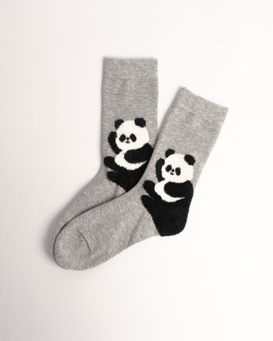 A pair of heather gray crew socks featuring a black and white knit panda design on the lower leg, displayed on a clean white background.