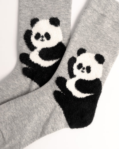 A pair of heather gray socks featuring a large black and white panda design on the front, photographed against a clean white background.
