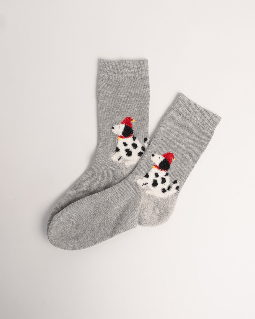 Grey cotton crew socks featuring a fuzzy spotted dog wearing a red Santa hat