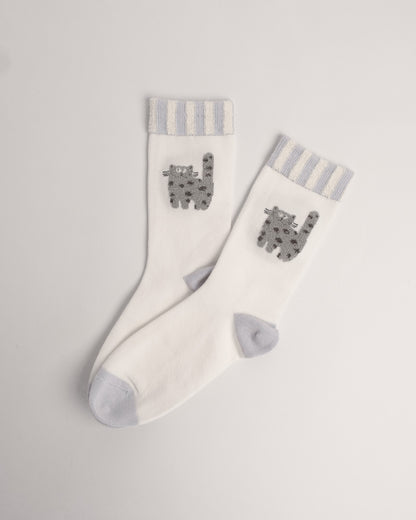 White cotton crew socks featuring a fuzzy grey cat and striped cuffs