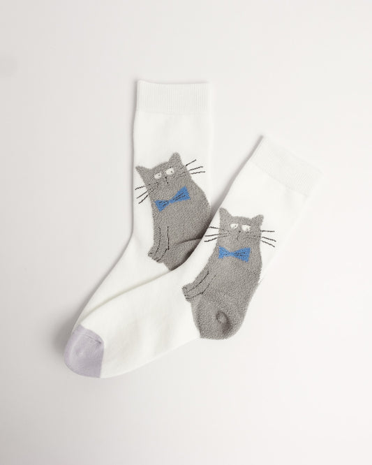 A pair of white crew socks with gray cat graphics wearing blue bow ties, displayed on a clean off-white background.