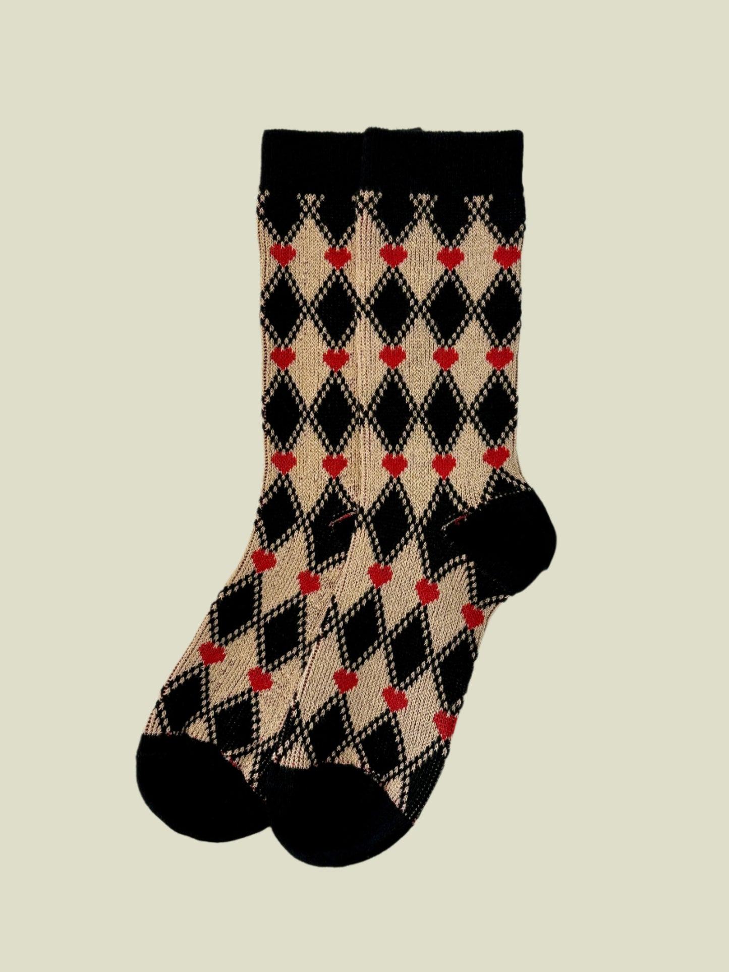 Plaid socks with red hearts on a light gray background