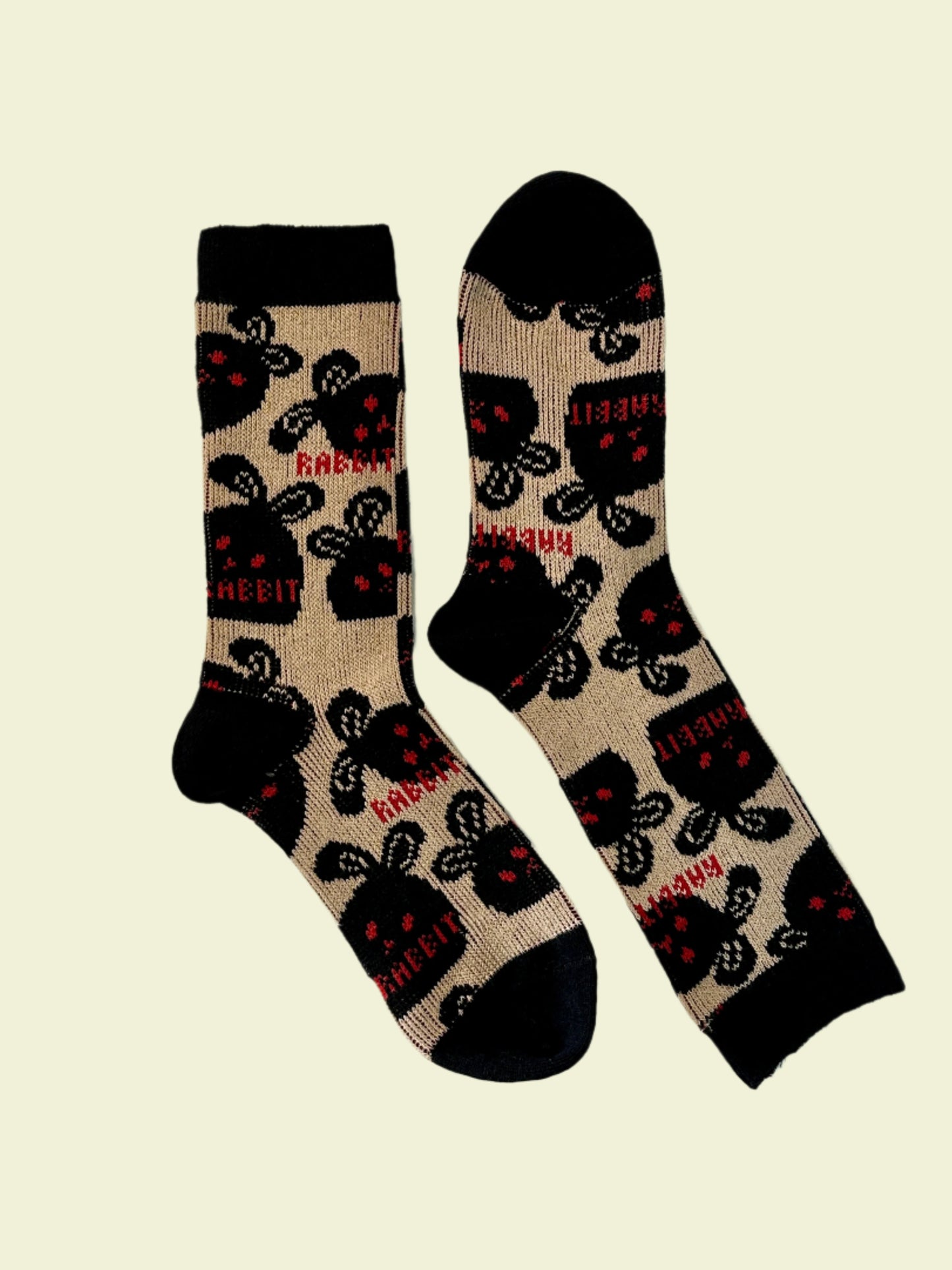 Pair of socks with rabbit pattern on a light background