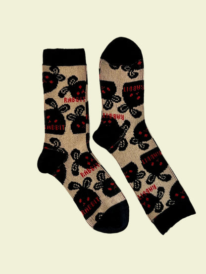 Pair of socks with rabbit pattern on a light background