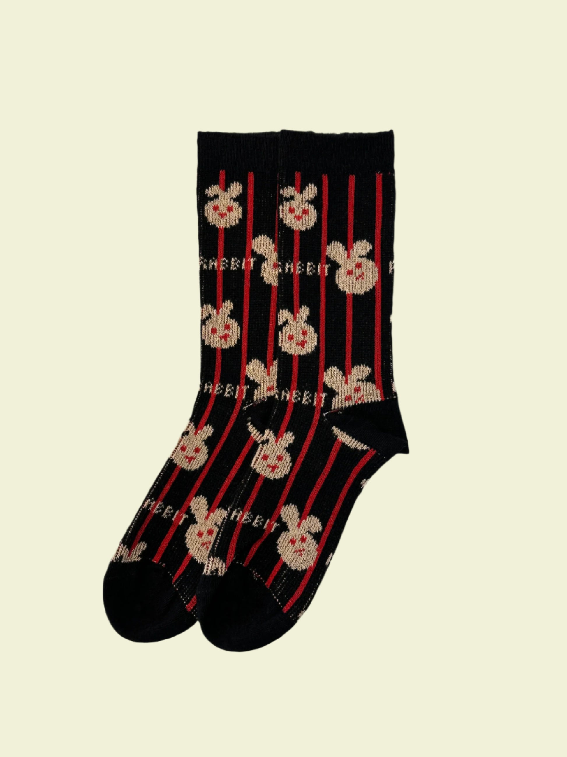 Pair of socks with skull and crossbones design on a light gray background