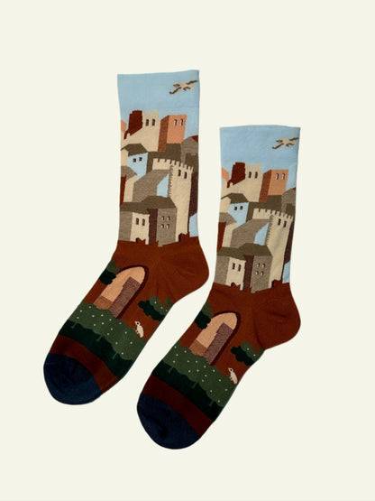 Aesthetic socks designed with warm tones and retro skyline, great for novelty socks collections.