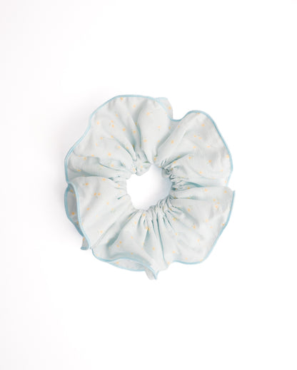 Sweet Daisy Scalloped Sheer XL Scrunchie in light blue featuring mini daisy print and scalloped crochet edge on flat lay white background