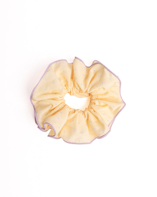 Lavender Trim Yellow Floral Sheer Hair Scrunchie in yellow featuring purple floral print and lavender trim on flat lay white background
