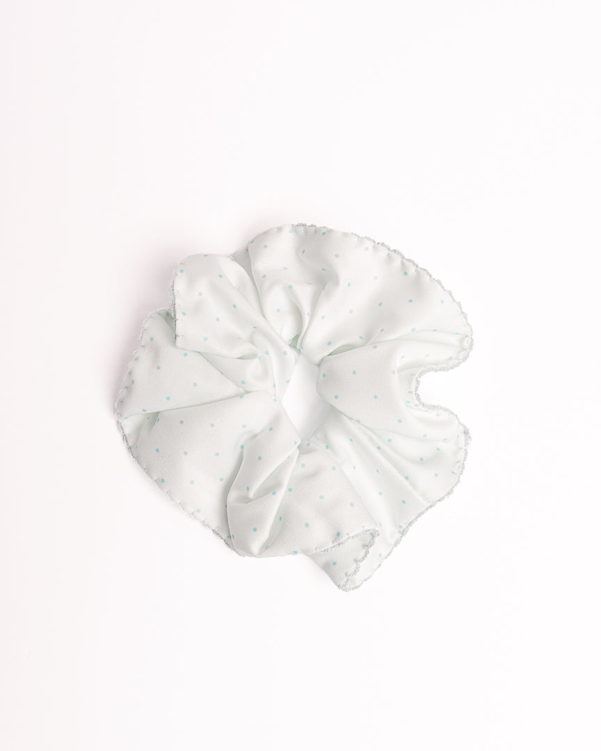 Polka Dot Silky Hair Scrunchie in mint green with blue dots and scalloped crochet edge on flat lay white background