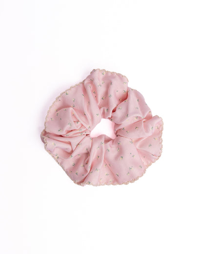 Ditsy Floral Scalloped Silky Hair Scrunchie in pink featuring mini floral print and scalloped crochet edge on flat lay white background