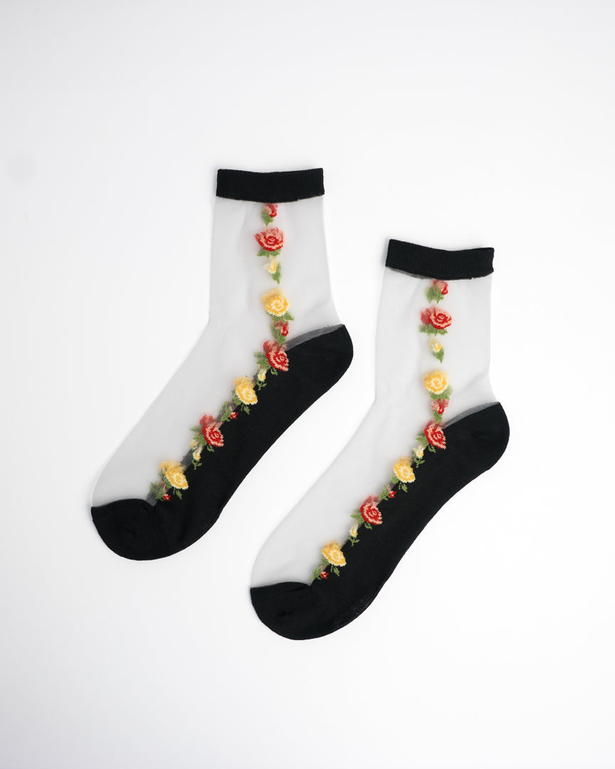 Red & Yellow Floral Sheer Crew Socks in black with rose embroidery on flat lay white background