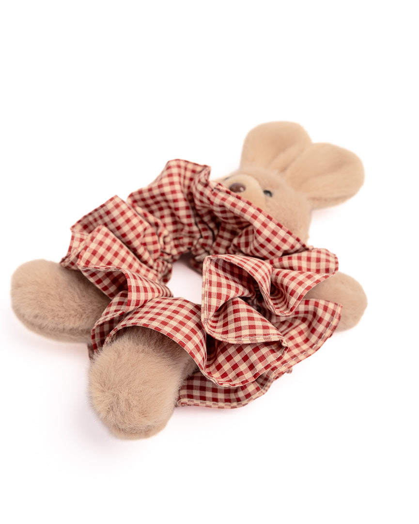 Side view of fluffy rabbit hair scrunchie in red and white check fabric showcasing soft texture and bunny features