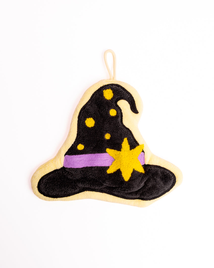Cute Witch Hat Kitchen Hanging Hand Towel in black featuring yellow stars, purple hat band, and hanging loop on flat lay white background
