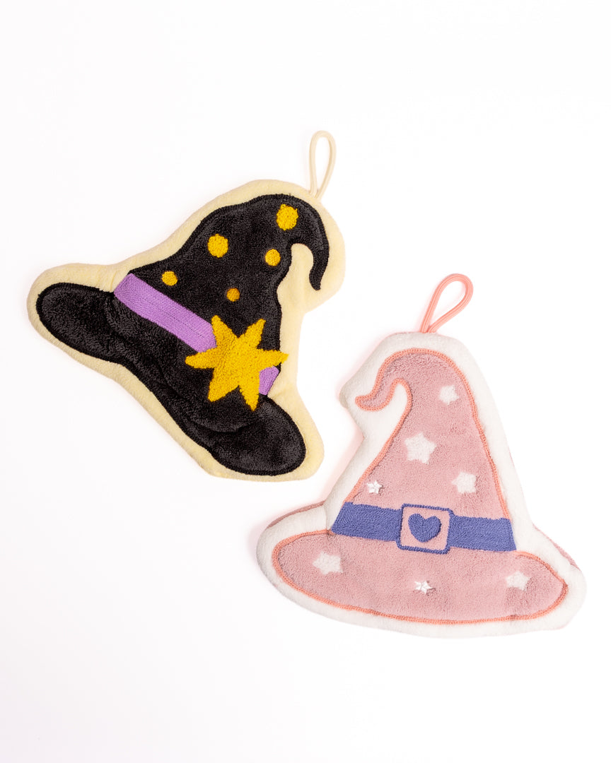 Cute Witch Hat Kitchen Hanging Hand Towels showing both black star and pink heart witch hat variants on flat lay white background