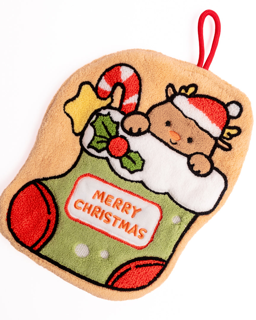 Detailed view of cute reindeer wearing Santa hat on Christmas stocking hanging hand towel