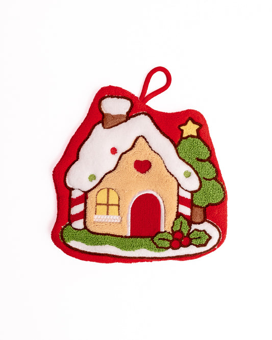 Christmas Gingerbread House Hanging Hand Towel in red featuring snowy candy house, Christmas tree, and hanging loop on flat lay white background