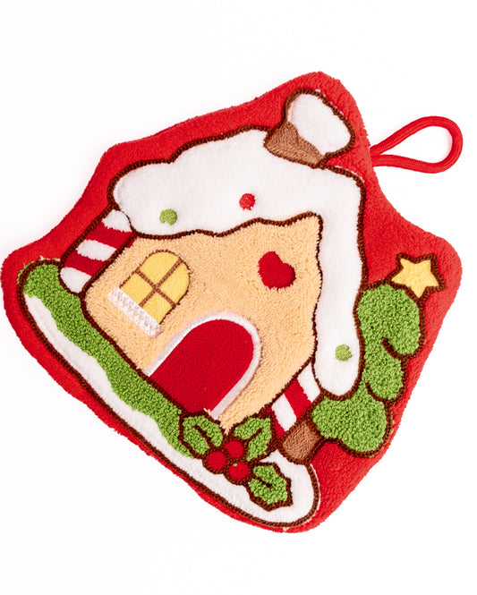 Close-up of red Christmas gingerbread house hanging hand towel showing detailed embroidery and holiday graphics