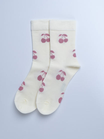 White socks with pink cherry pattern on a light gray background